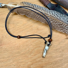 Load image into Gallery viewer, Handmade Norse rune necklace featuring a carved antler pendant on leather. Symbolic tribal jewelry inspired by ancient traditions.