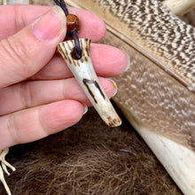 Load image into Gallery viewer, Handmade Norse rune necklace featuring a carved antler pendant on leather. Symbolic tribal jewelry inspired by ancient traditions.
