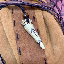 Load image into Gallery viewer, Handmade Norse rune necklace with carved antler pendant on leather cord.