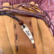 Load image into Gallery viewer, Handmade Norse rune necklace featuring a carved antler pendant on leather.