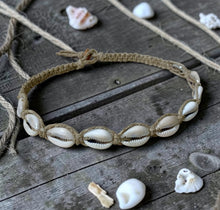Load image into Gallery viewer, Shell necklace on a wooden surface with seashells around