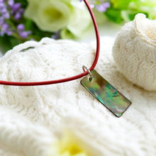 Load image into Gallery viewer, Sea Stone Amulet – Handmade Leather Necklace with Iridescent Paua Shell