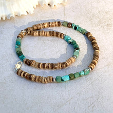 Load image into Gallery viewer, A handcrafted tribal necklace with waxed coconut beads in a natural color range and blue glass beads, featuring genuine turquoise nuggets, displayed against a light background.
