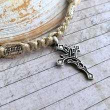 Load image into Gallery viewer, A handcrafted thick hemp necklace with a Celtic cross pendant, displayed in front of a textured backdrop.
