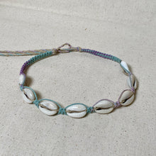 Load image into Gallery viewer, Bracelet with shell beads on a textured beige background
