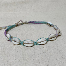 Load image into Gallery viewer, Bracelet with shell beads on a textured beige background
