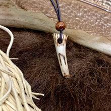 Load image into Gallery viewer, Handmade Norse rune necklace featuring a carved antler pendant on leather. Symbolic tribal jewelry inspired by ancient traditions.
