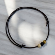 Load image into Gallery viewer, Leather Necklace with Wooden Ball Pendant – Modern Minimalist Style
