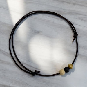 Leather Necklace with Wooden Ball Pendant – Modern Minimalist Style