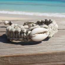 Load image into Gallery viewer, Close-up of a crab holding a shell on a beach
