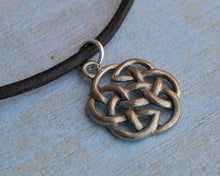 Load image into Gallery viewer, Close-up of pewter Celtic knot pendant on leather necklace
